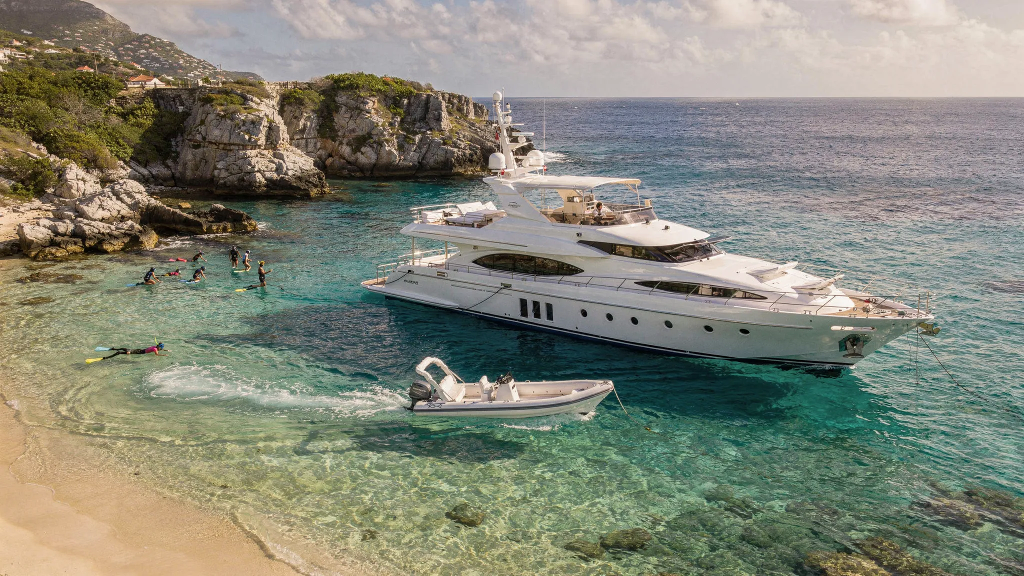 Luxury yacht anchored off a Caribbean bay